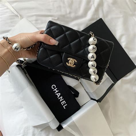 chanel white pearl bag|Chanel bag with pearl chain.